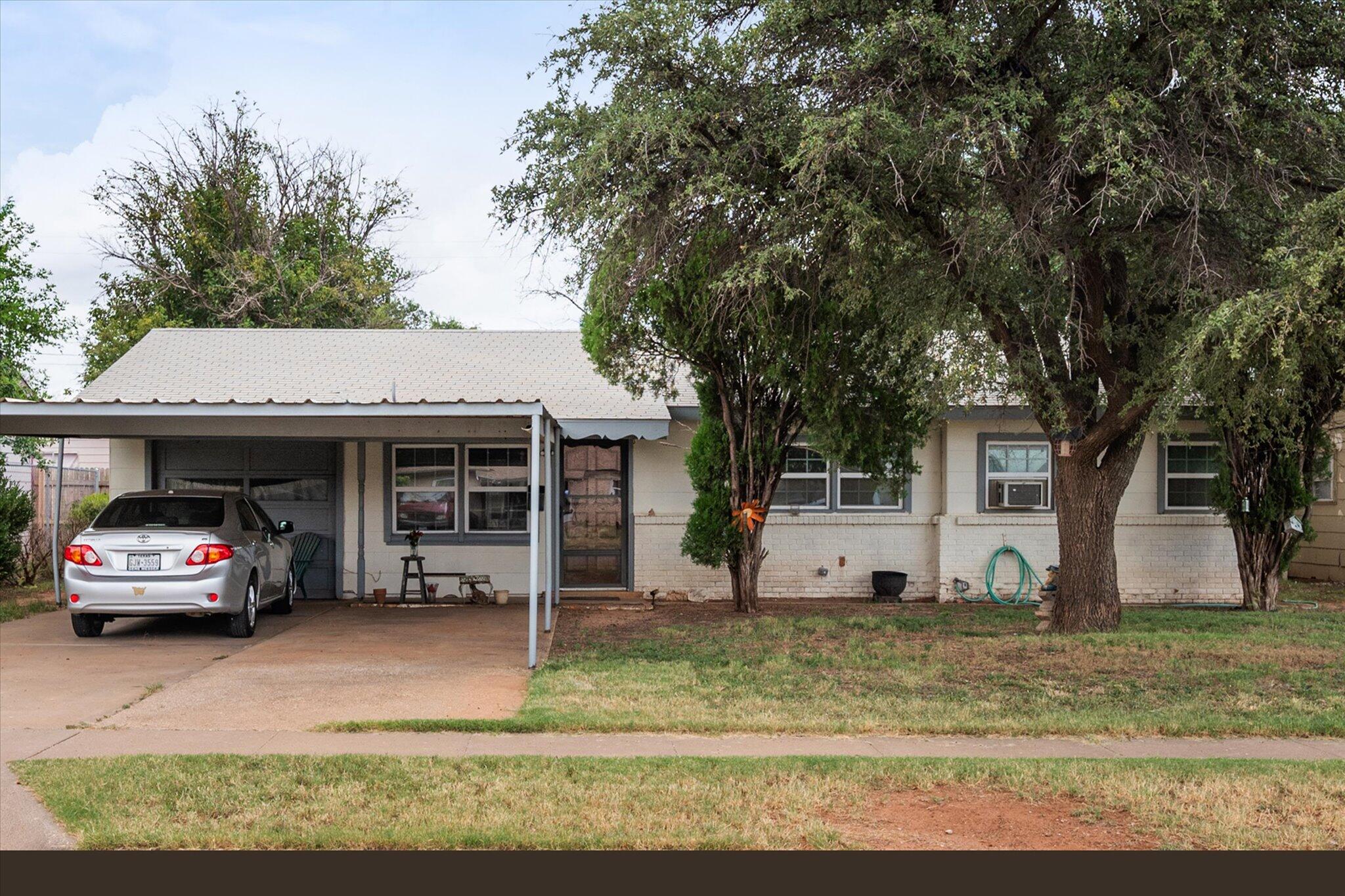 3407 East Colgate Street Lubbock, TX 79403 - Photo 2 of 22 a view of a car parked in front of a house