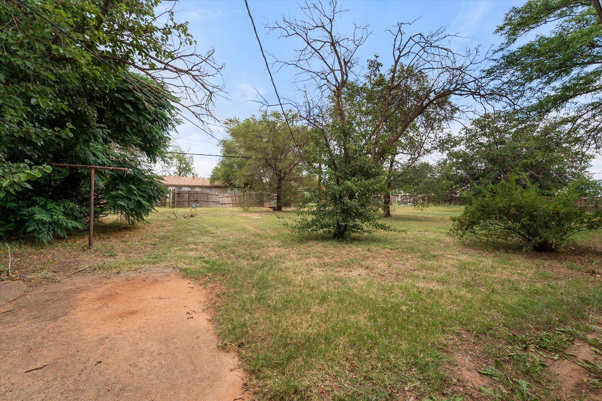 3407 East Colgate Street Lubbock, TX 79403 - Photo 22 of 22 a backyard of a house with lots of green space