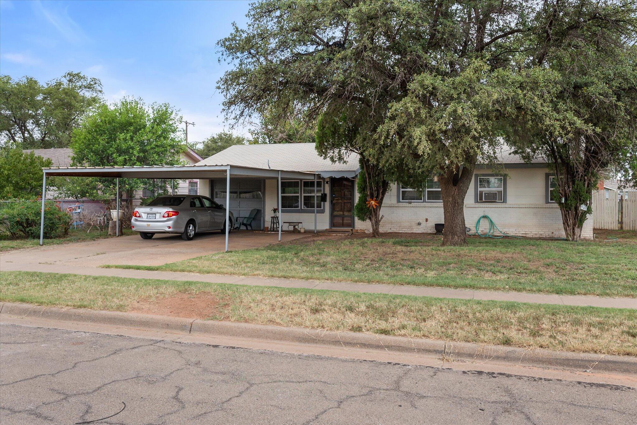 3407 East Colgate Street Lubbock, TX 79403 - Photo 3 of 22 a view of a car park in front of house