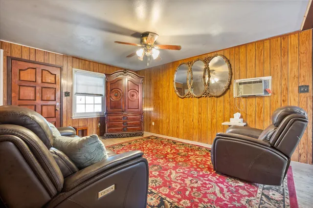 a living room with furniture and a window