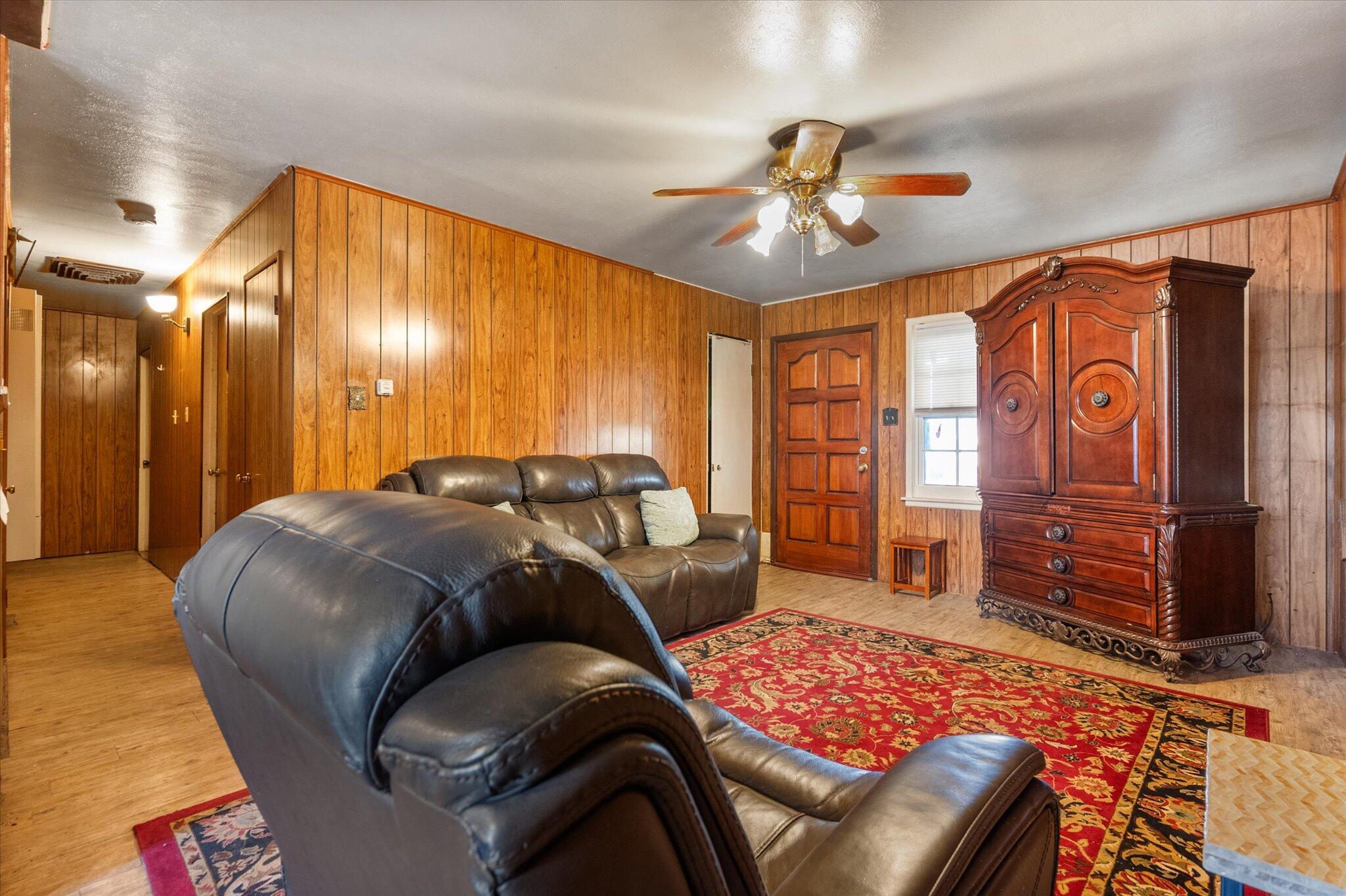 3407 East Colgate Street Lubbock, TX 79403 - Photo 7 of 22 a bedroom with a bed and wooden floor