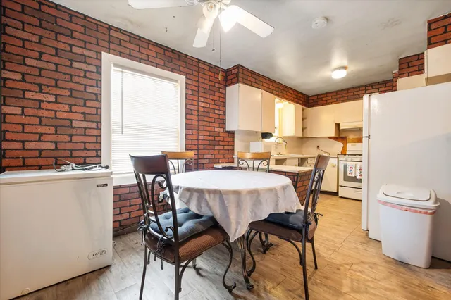 a view of a dining room with furniture and window