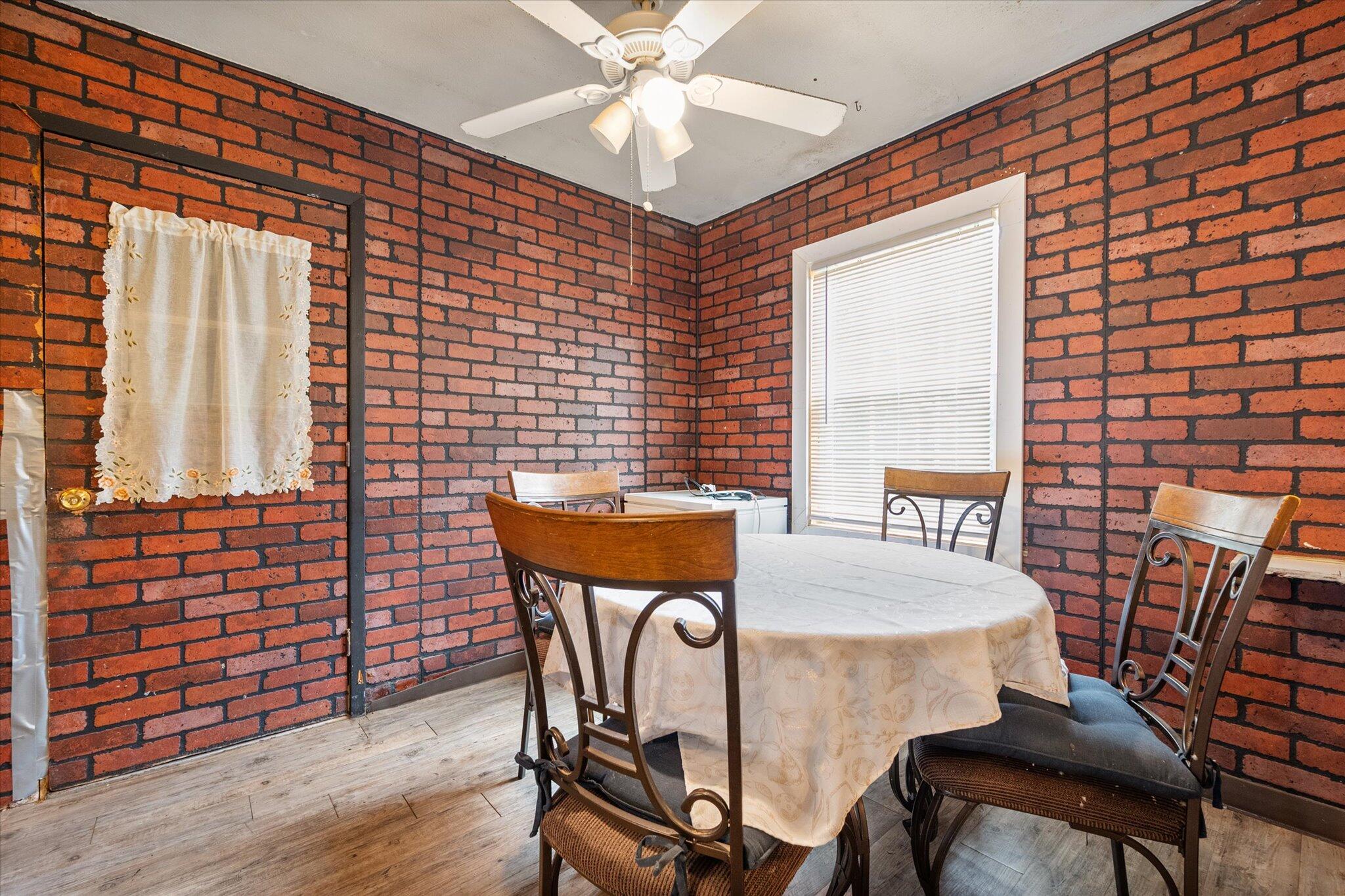 3407 East Colgate Street Lubbock, TX 79403 - Photo 10 of 22 a dining room with furniture and window