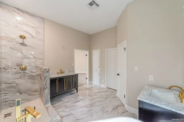 a view of a storage & utility room with a sink