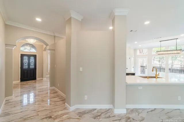 a view of a bathroom with sink and shower