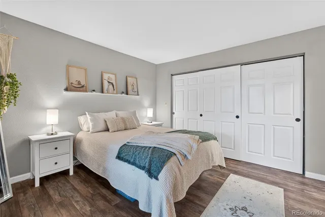 a spacious bedroom with a bed and a window