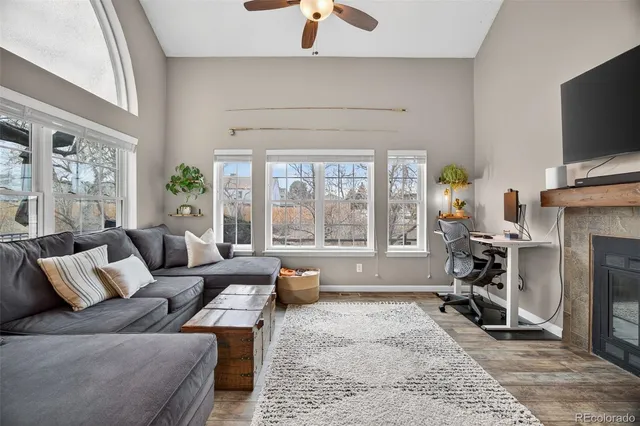 a living room with furniture and a fireplace