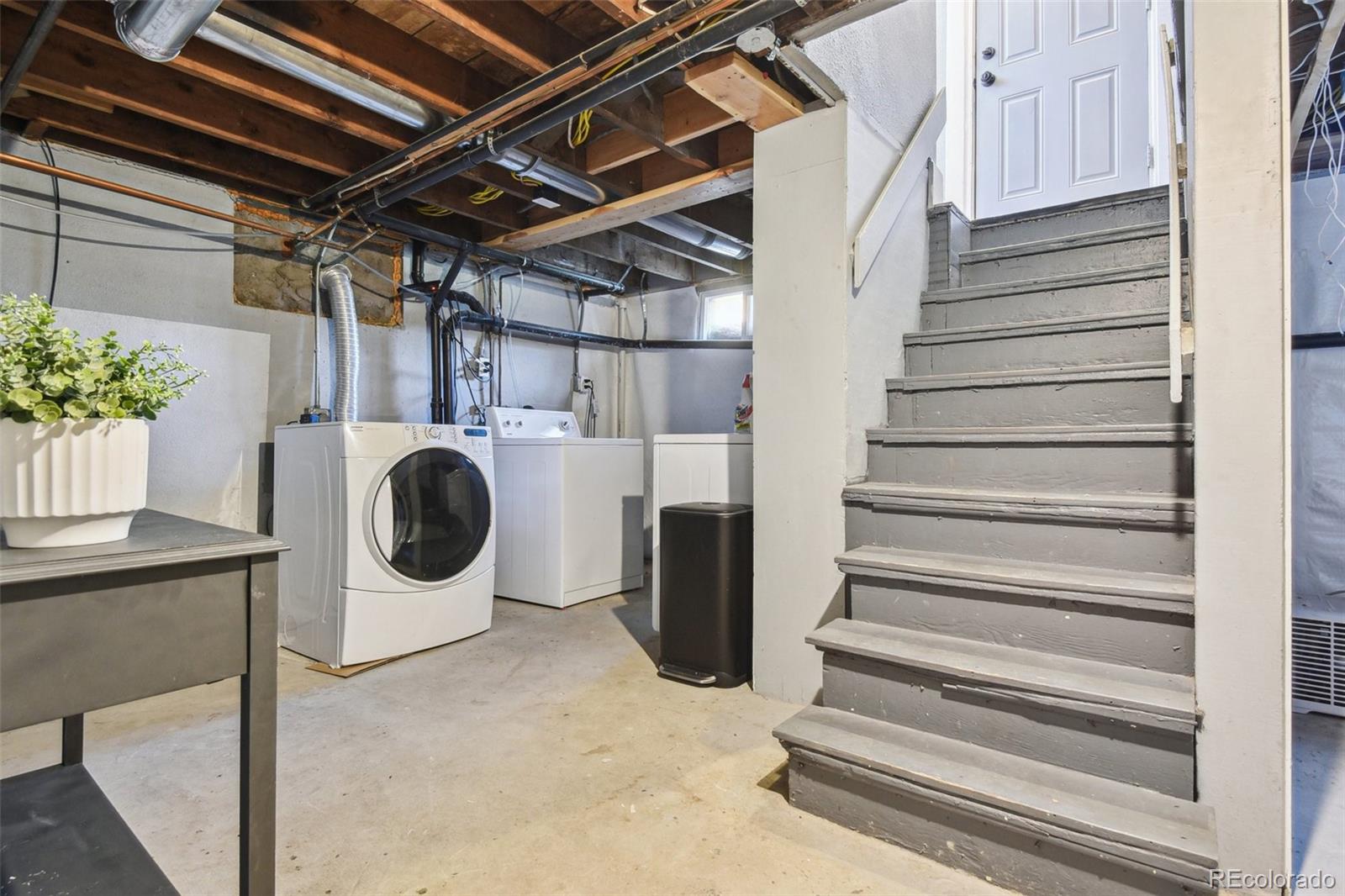 3946 Perry Street Denver, CO 80212 - Photo 20 of 27 a view of a storage & utility room with wooden floor