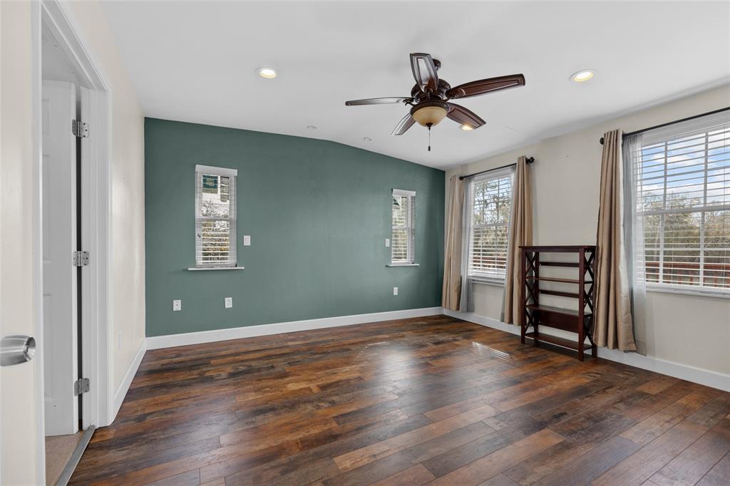 3130 Southwest 86th Way Bell, FL 32619 - Photo 12 of 52 wooden floor in an empty room with a window