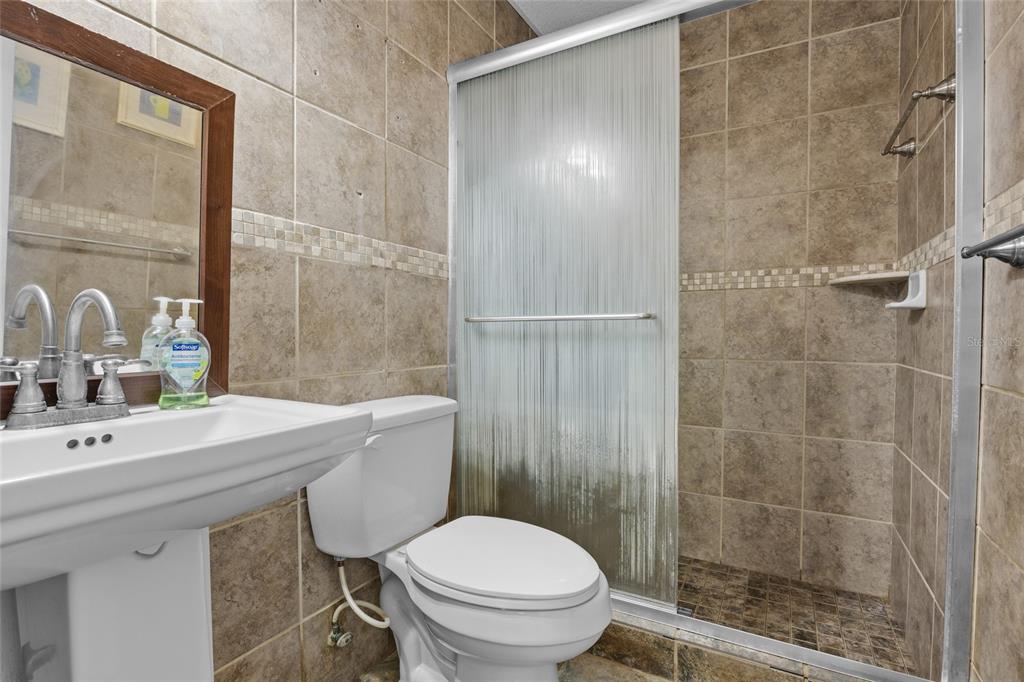 3130 Southwest 86th Way Bell, FL 32619 - Photo 23 of 52 a bathroom with a sink toilet and shower