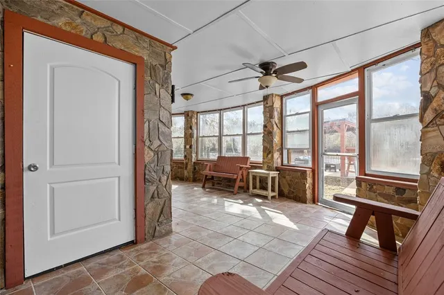 a open kitchen with stainless steel appliances granite countertop a stove and a refrigerator