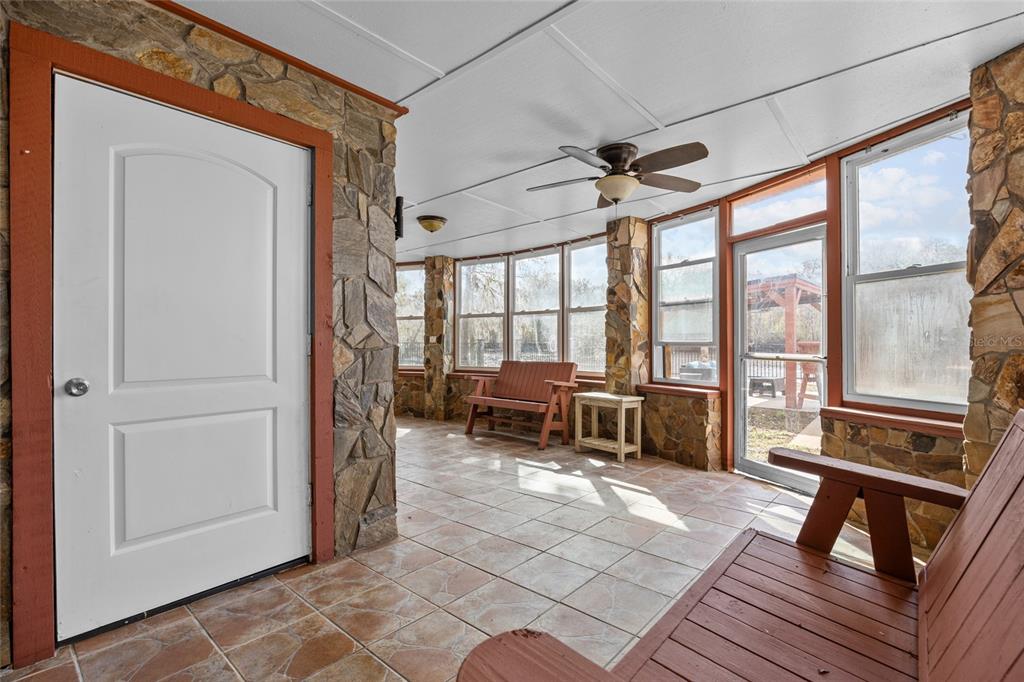 3130 Southwest 86th Way Bell, FL 32619 - Photo 25 of 52 a living room with furniture and a table
