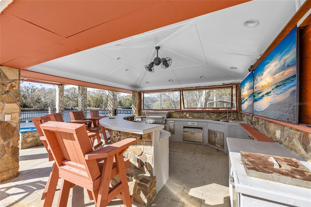 3130 Southwest 86th Way Bell, FL 32619 - Photo 29 of 52 a dining room with furniture window and outdoor view