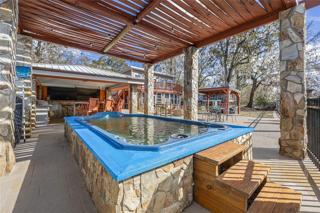 3130 Southwest 86th Way Bell, FL 32619 - Photo 32 of 52 a view of a swimming pool with a patio