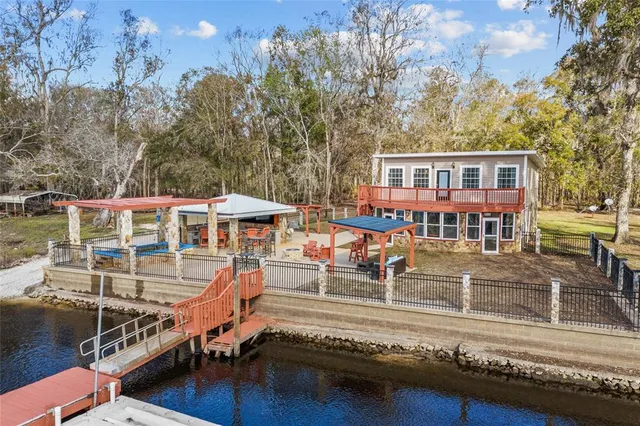 an outdoor space with swimming pool and furniture