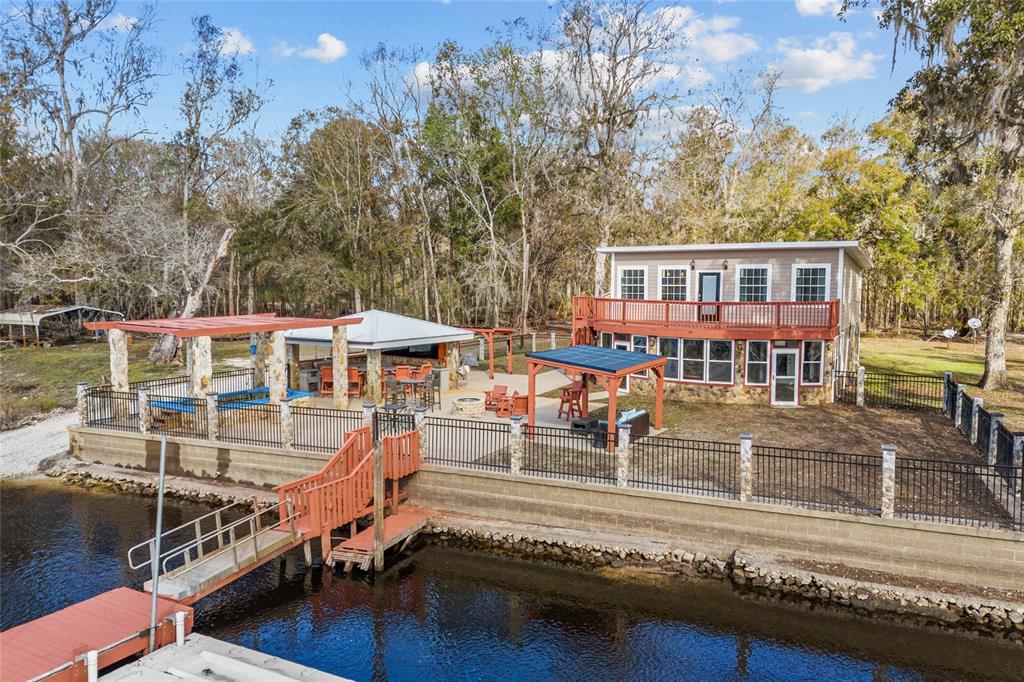 3130 Southwest 86th Way Bell, FL 32619 - Photo 36 of 52 a view of a house with pool and sitting area