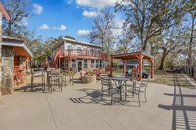 a roof deck with a table and chairs