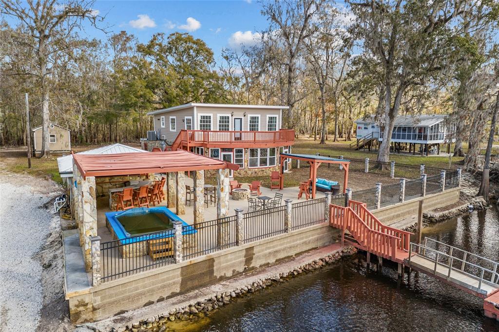 3130 Southwest 86th Way Bell, FL 32619 - Photo 39 of 52 an outdoor space with swimming pool and furniture