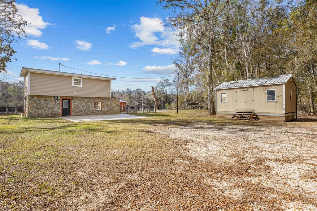 3130 Southwest 86th Way Bell, FL 32619 - Photo 42 of 52 a view of a house with a yard