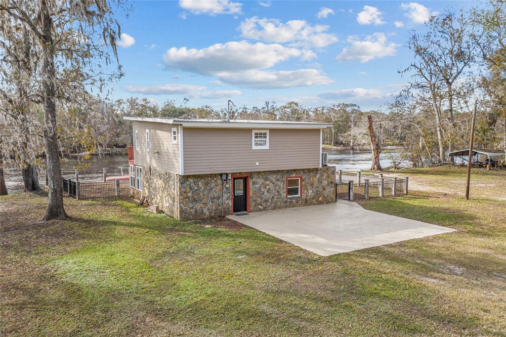 3130 Southwest 86th Way Bell, FL 32619 - Photo 43 of 52 a view of a terrace with a garden