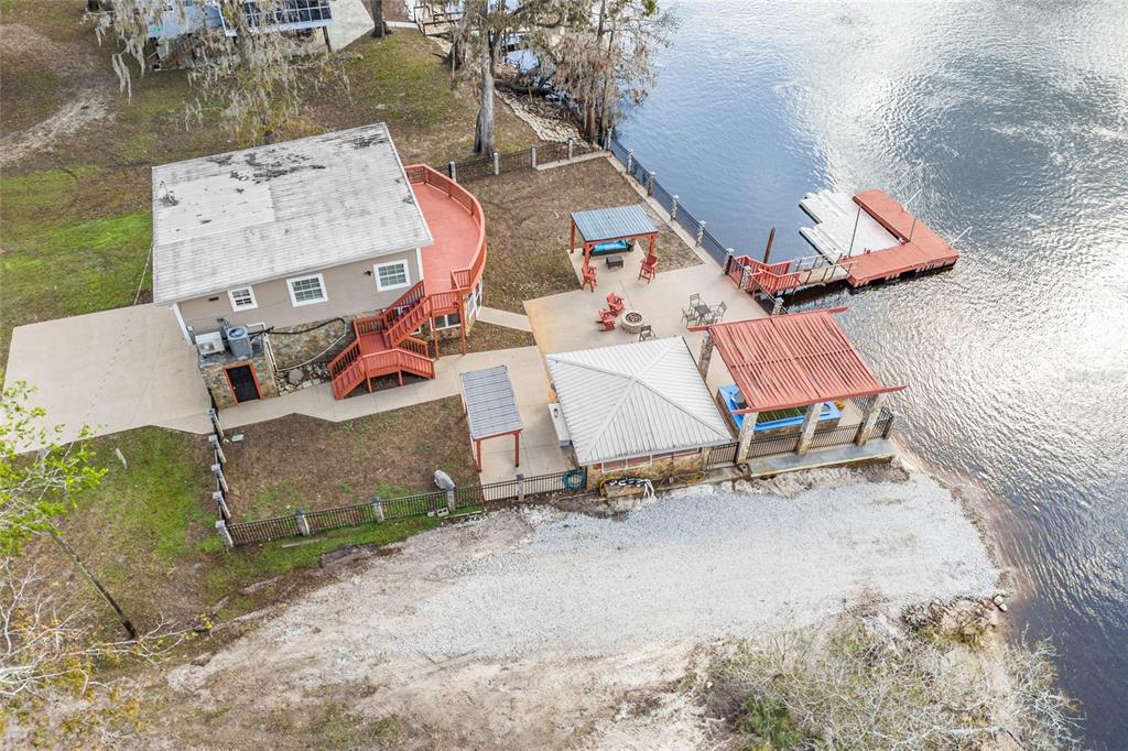 3130 Southwest 86th Way Bell, FL 32619 - Photo 46 of 52 an aerial view of a chairs and table in the patio