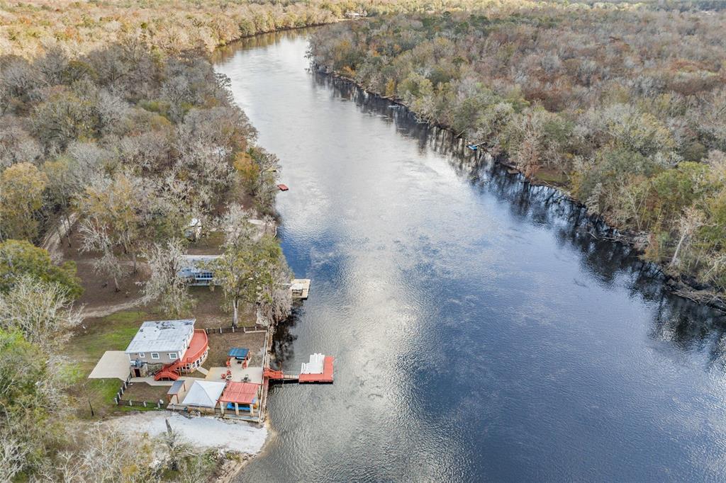 3130 Southwest 86th Way Bell, FL 32619 - Photo 48 of 52 a backyard of a house with outdoor seating