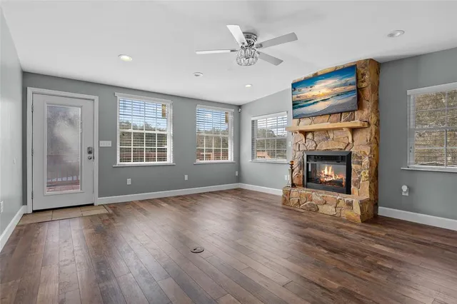 a view of a livingroom with furniture and wooden floor
