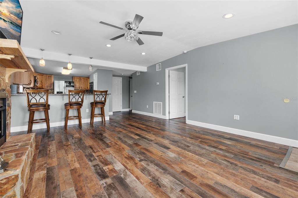 3130 Southwest 86th Way Bell, FL 32619 - Photo 7 of 52 a view of a livingroom with furniture and wooden floor