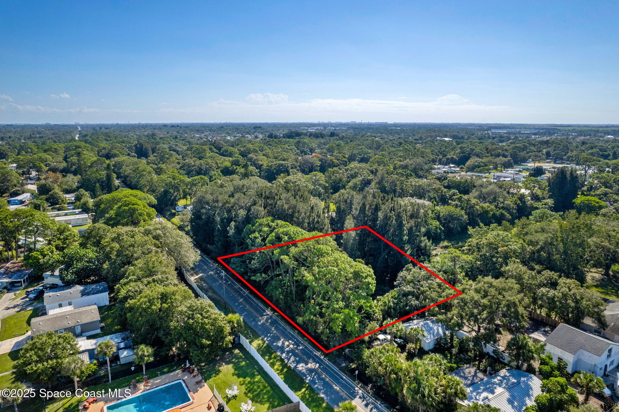 4301 White Road Melbourne, FL 32934 - Photo 7 of 8 an aerial view of a houses with a yard and street