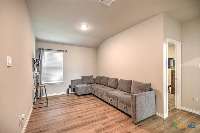 a view of a workspace with furniture