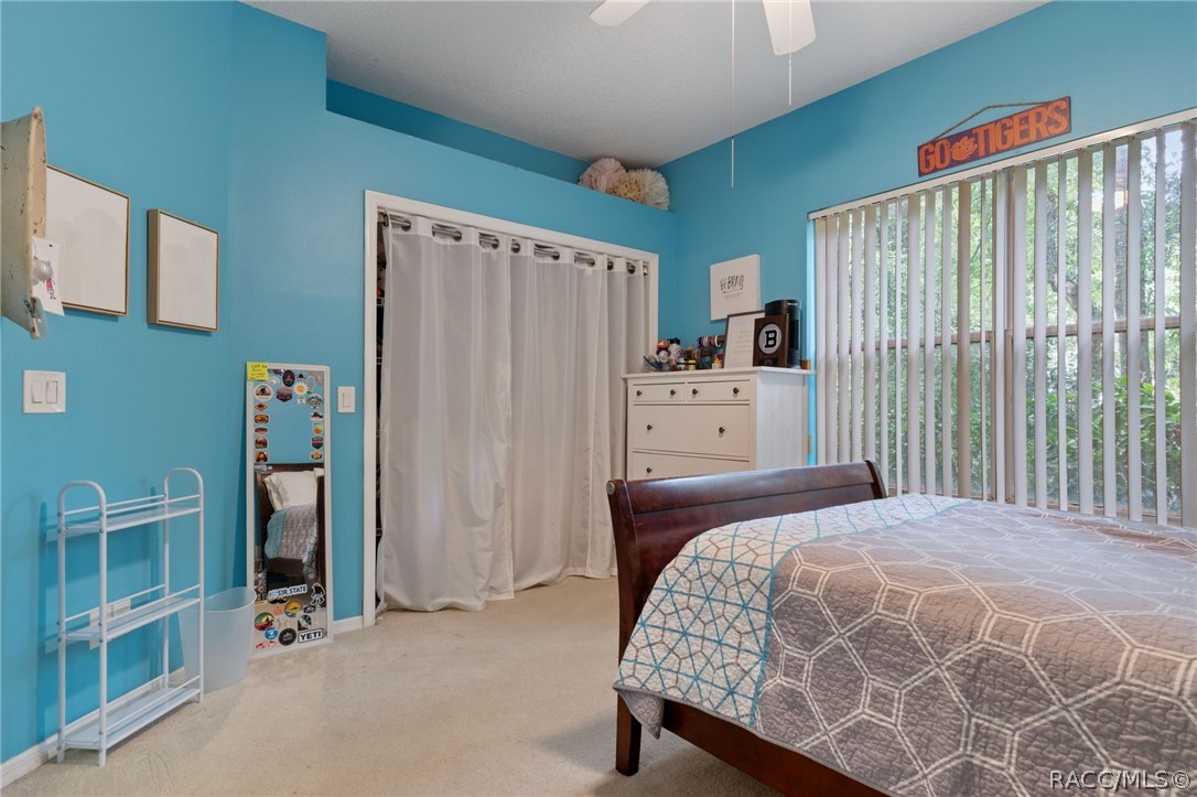 2460 West Pine Ridge Boulevard Beverly Hills, FL 34465 - Photo 29 of 47 a bedroom with a bed and a window