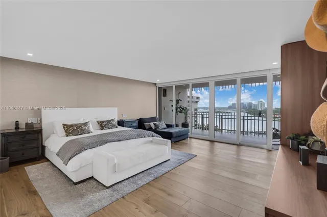 a bedroom with a bed couch and a window