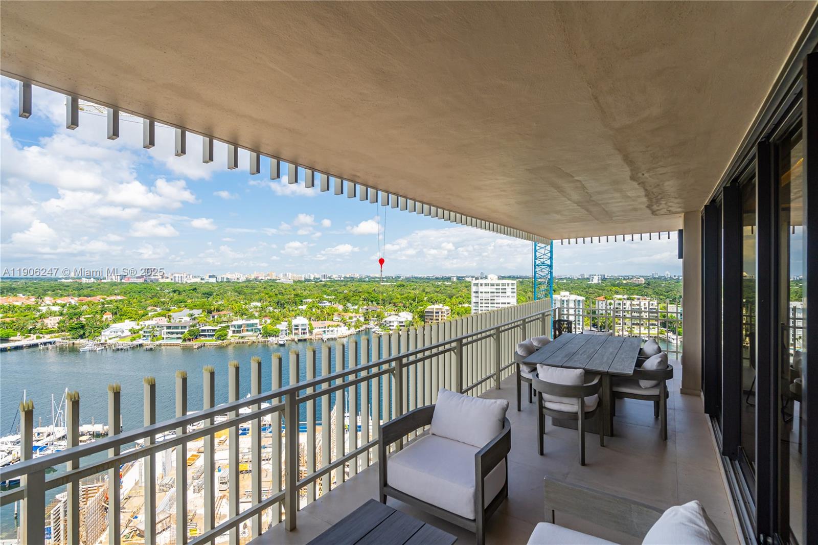 3 Grove Isle Drive, Unit C1710 Miami, FL 33133 - Photo 11 of 37 a city view from a balcony with outdoor seating