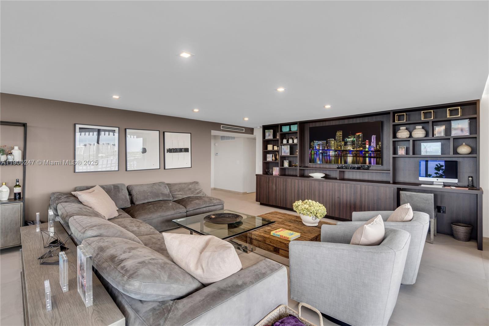 3 Grove Isle Drive, Unit C1710 Miami, FL 33133 - Photo 13 of 37 a living room with furniture and a wooden floor