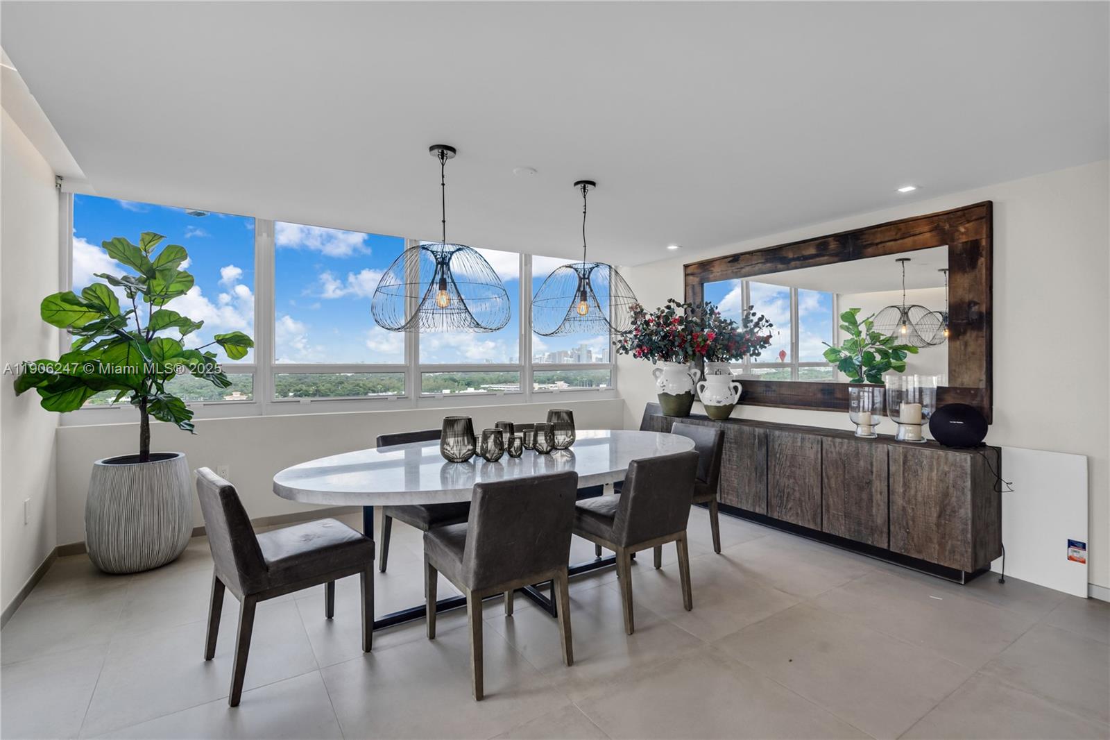 3 Grove Isle Drive, Unit C1710 Miami, FL 33133 - Photo 14 of 37 a dining room with furniture and window