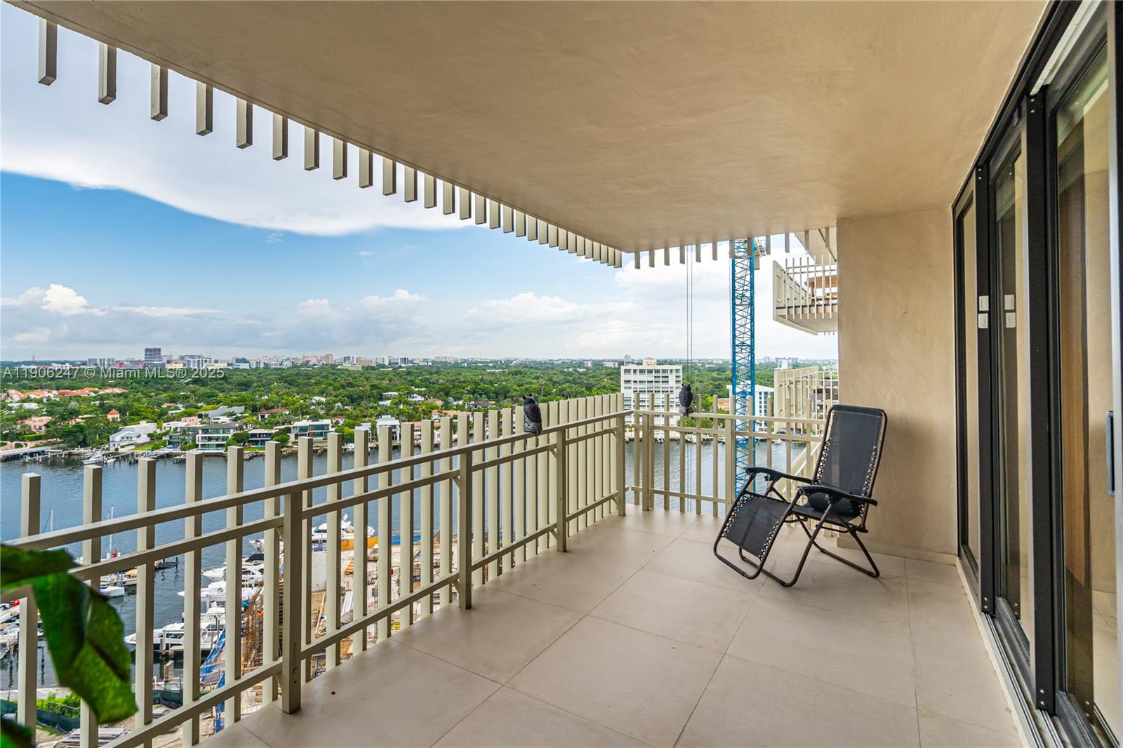 3 Grove Isle Drive, Unit C1710 Miami, FL 33133 - Photo 30 of 37 a view of a balcony with furniture and city view