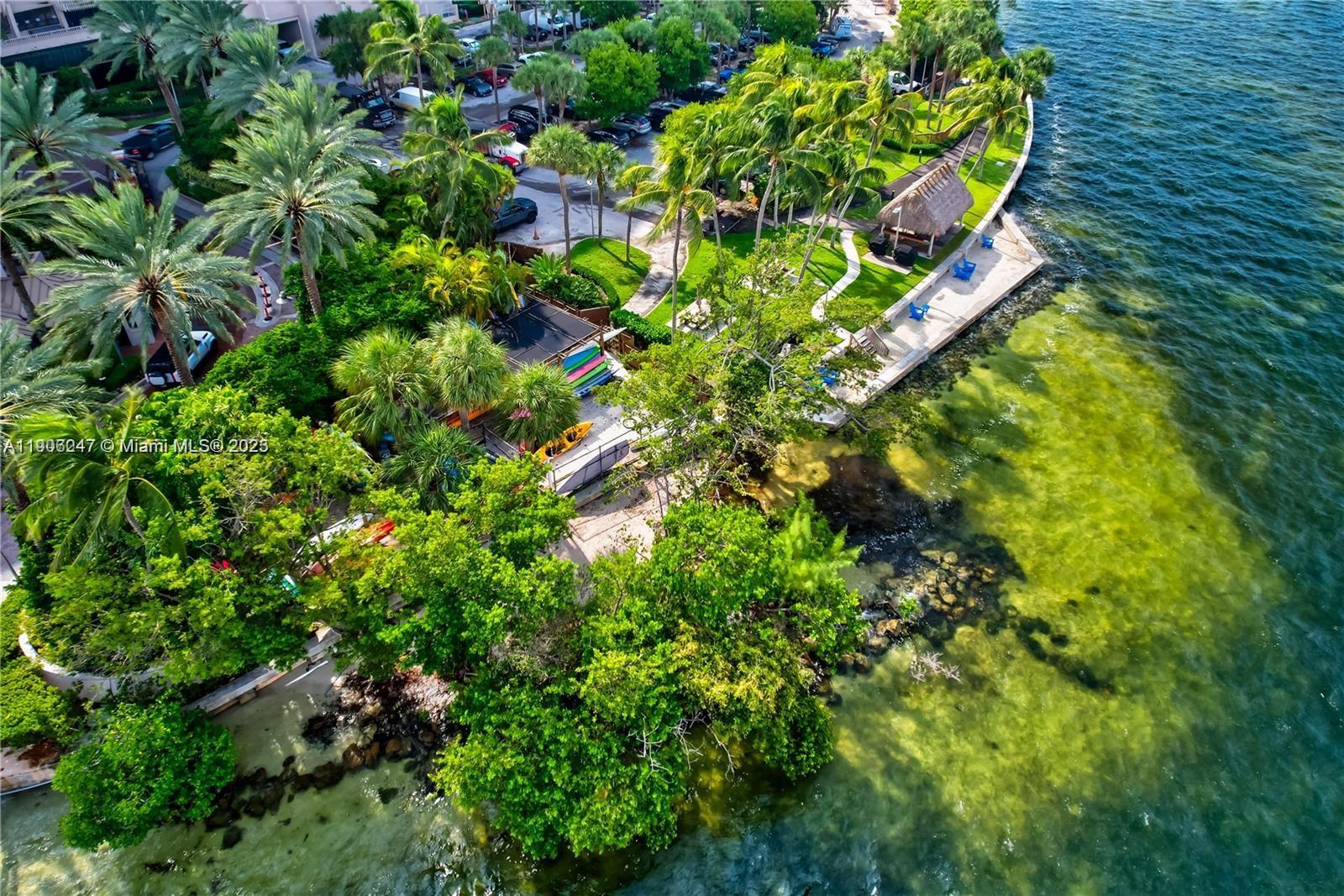 3 Grove Isle Drive, Unit C1710 Miami, FL 33133 - Photo 37 of 37 a backyard of a house with lots of green space