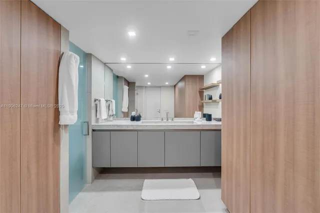 a bathroom with a sink a mirror and a toilet