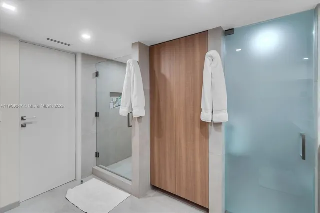 a bathroom with a shower and a sink