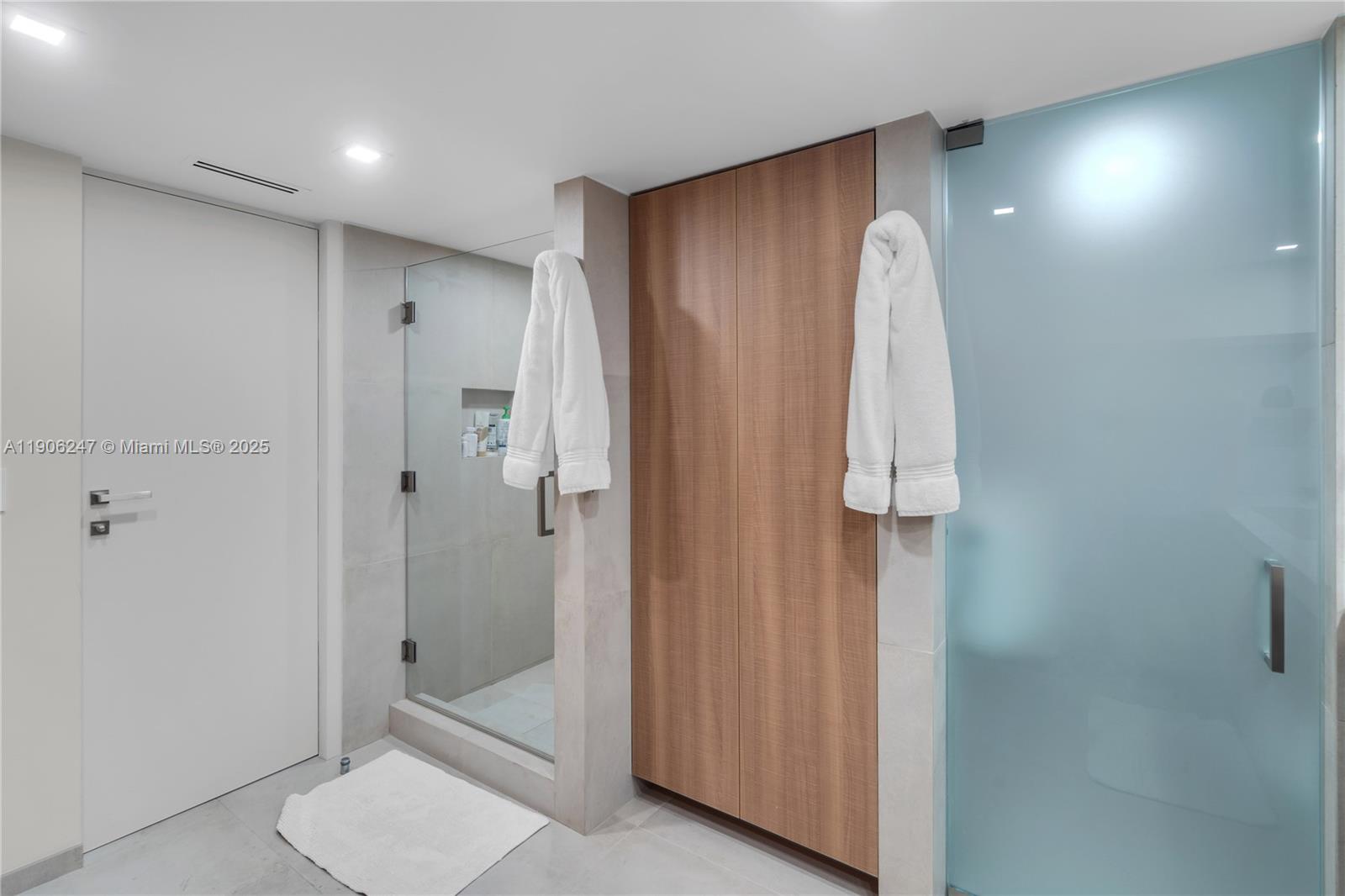 3 Grove Isle Drive, Unit C1710 Miami, FL 33133 - Photo 5 of 37 a bathroom with a shower and a sink