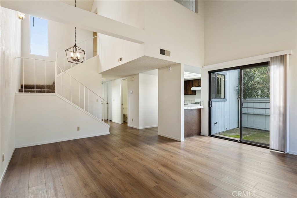 7 Quail Ridge Drive Atascadero, CA 93422 - Photo 7 of 29 an empty room with wooden floor and windows