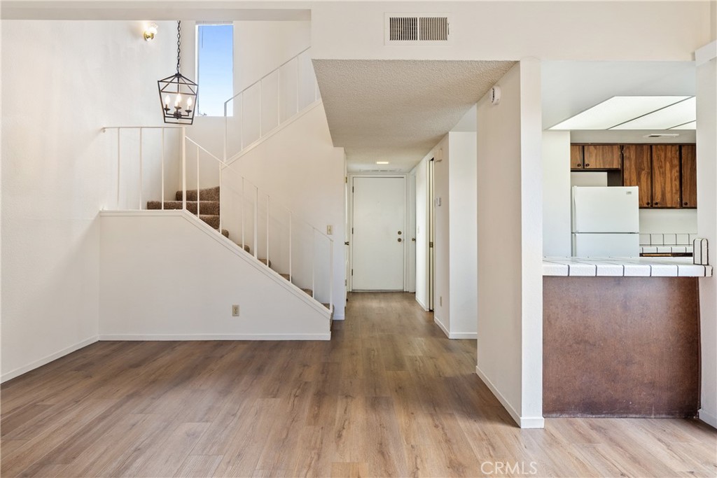 7 Quail Ridge Drive Atascadero, CA 93422 - Photo 10 of 29 wooden floor in an empty room with a window