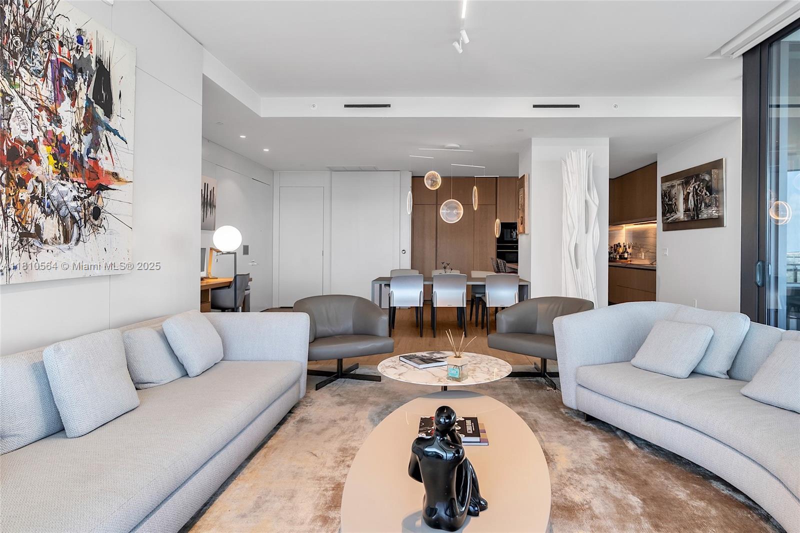 8701 Collins Avenue, Unit 905 Miami Beach, FL 33154 - Photo 13 of 80 a living room with furniture and wooden floor