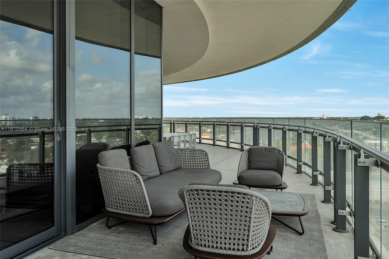 8701 Collins Avenue, Unit 905 Miami Beach, FL 33154 - Photo 23 of 80 a balcony with furniture