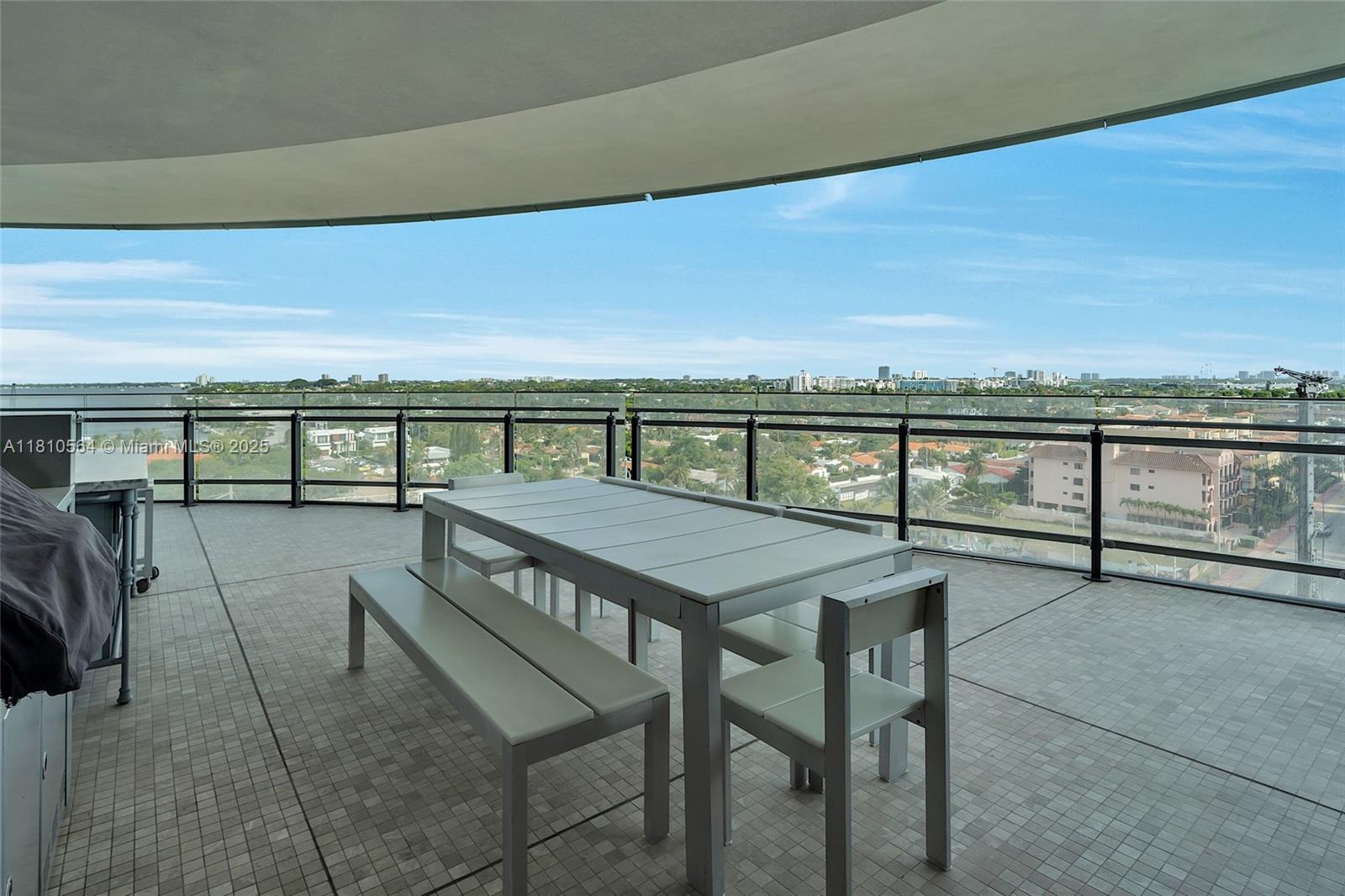 8701 Collins Avenue, Unit 905 Miami Beach, FL 33154 - Photo 26 of 80 a view of a balcony with chairs