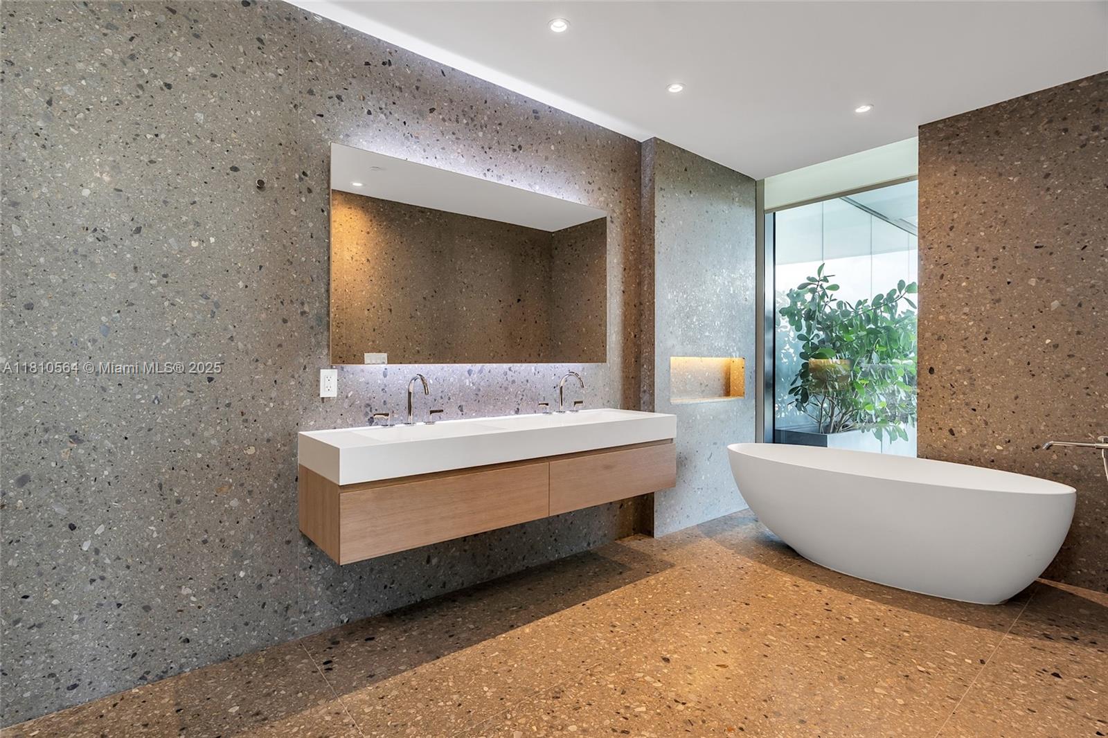 8701 Collins Avenue, Unit 905 Miami Beach, FL 33154 - Photo 33 of 80 a bathroom with a bathtub and potted plant