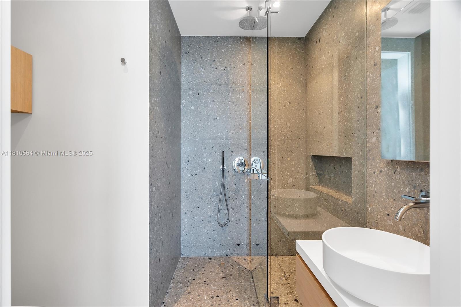 8701 Collins Avenue, Unit 905 Miami Beach, FL 33154 - Photo 42 of 80 a bathroom with a toilet and a shower