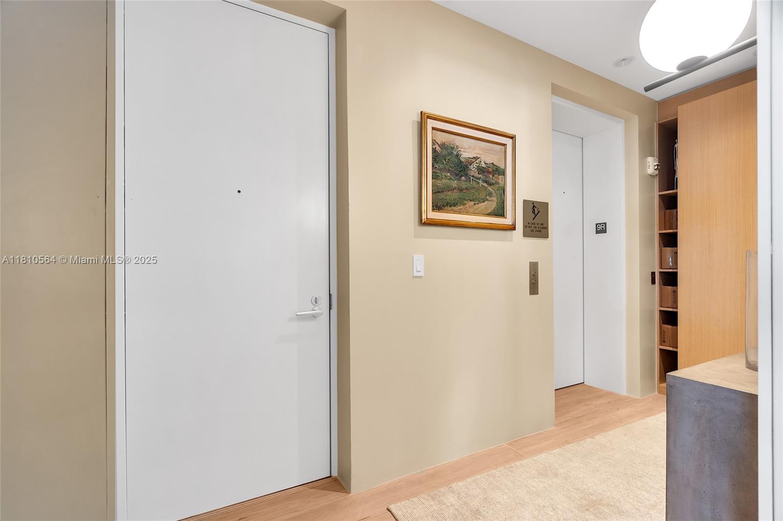 8701 Collins Avenue, Unit 905 Miami Beach, FL 33154 - Photo 44 of 80 a view of a hallway with wooden floor
