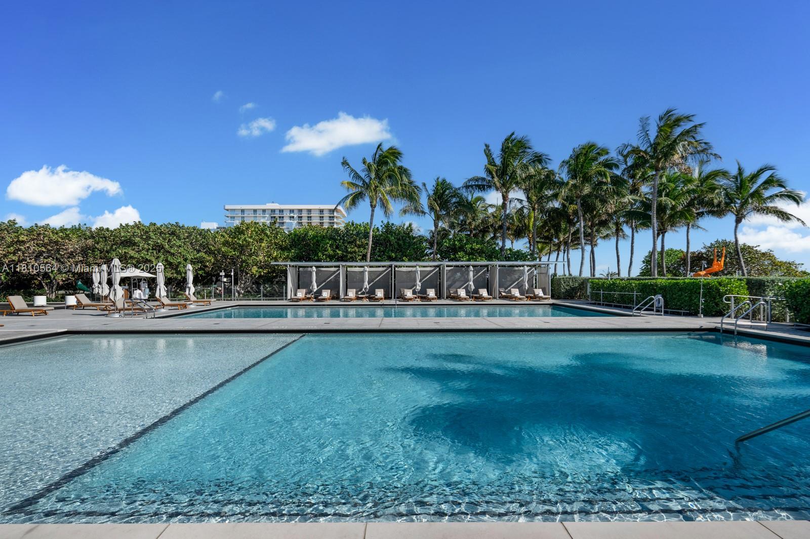 8701 Collins Avenue, Unit 905 Miami Beach, FL 33154 - Photo 51 of 80 a view of swimming pool and lake view