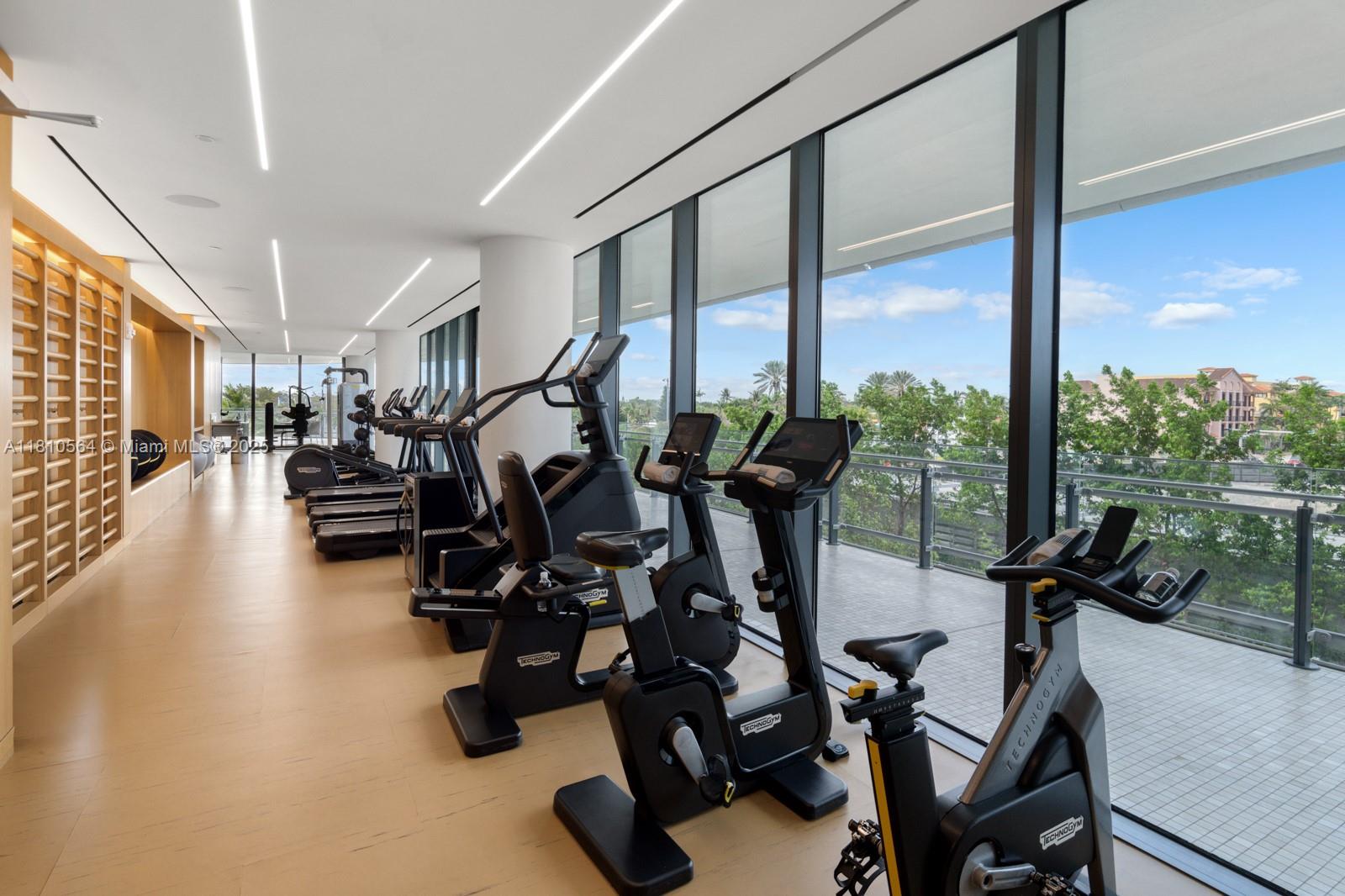 8701 Collins Avenue, Unit 905 Miami Beach, FL 33154 - Photo 58 of 80 a view of a room with gym equipment